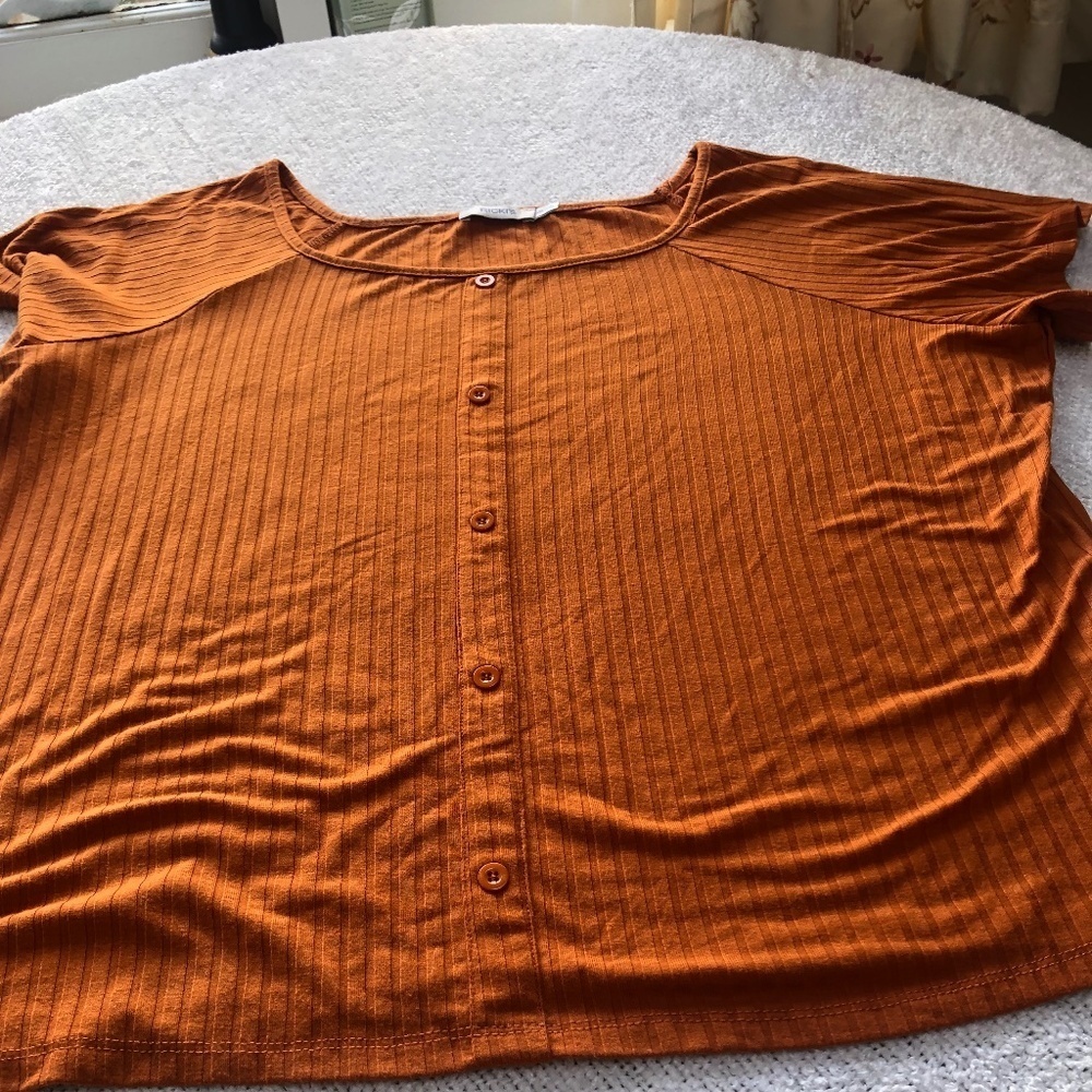 Ricki’s burnt orange button up top, short sleeves. Button top, new or like new
